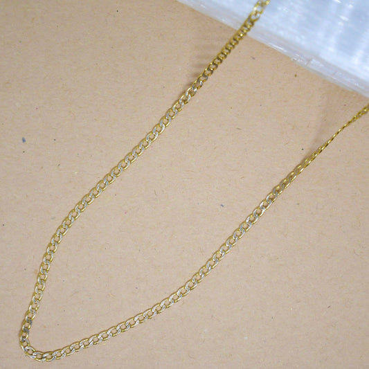 14k solid gold chain with a polished finish, featuring a secure lobster clasp, designed for versatile wear—perfect for layering or wearing solo.