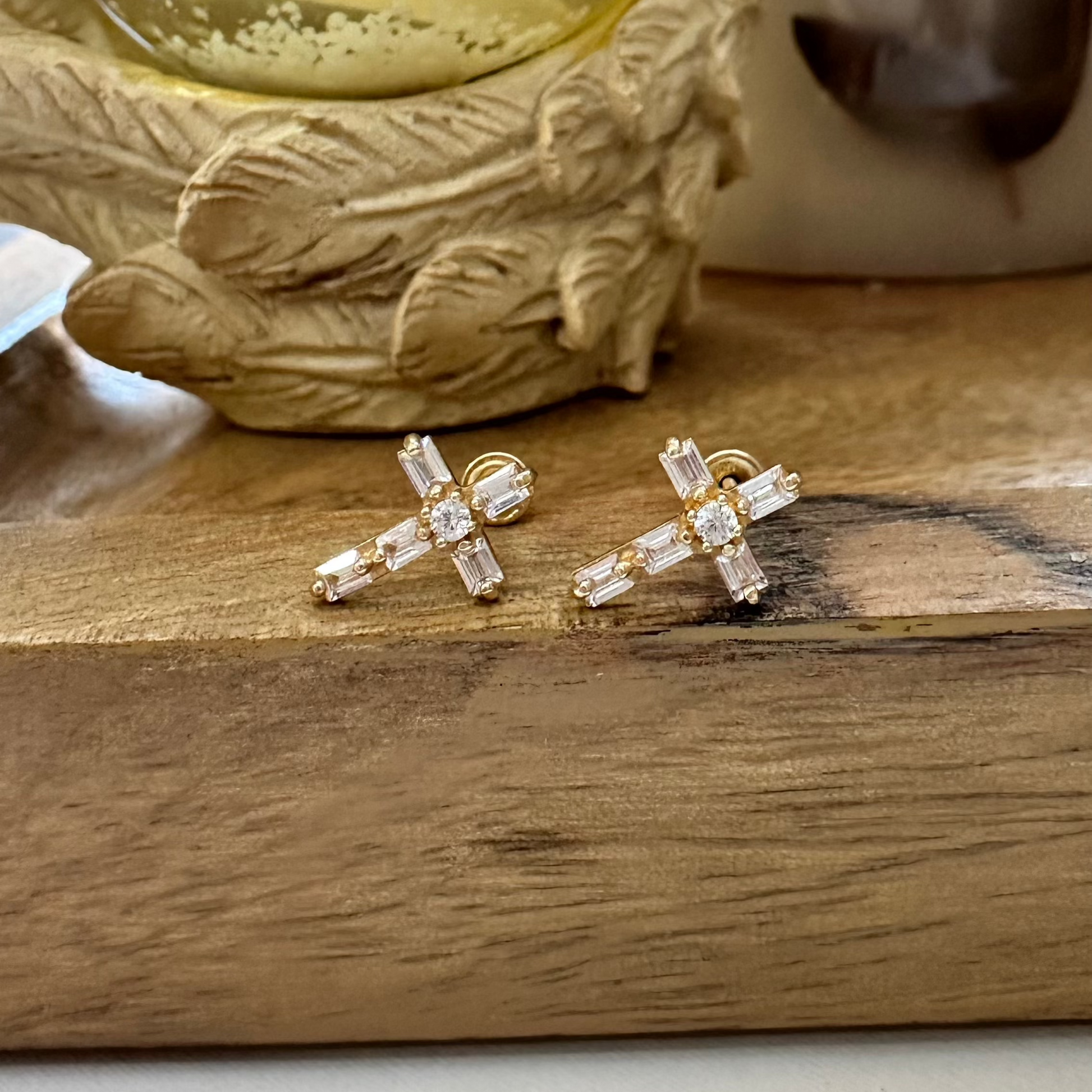 Faithful and fashionable: 14k gold cross earrings with cubic zirconia accents.