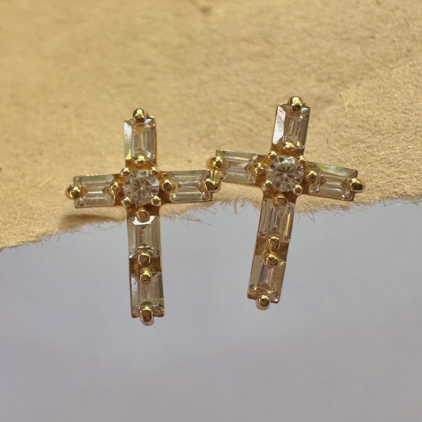 Faithful and fashionable: 14k gold cross earrings with cubic zirconia accents.